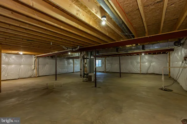 a view of empty room with wooden ceiling