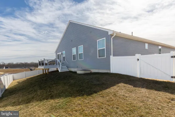 a view of a backyard of the house