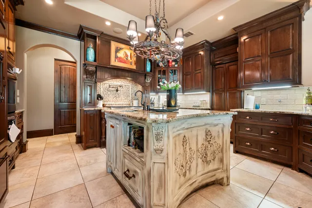 a kitchen that has a stove and a refrigerator