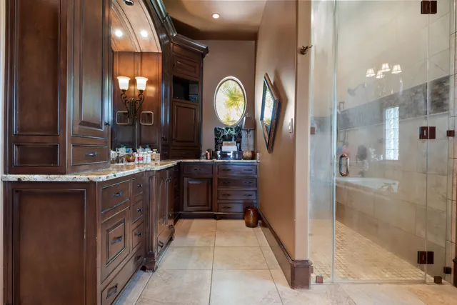 a bedroom with furniture and a chandelier
