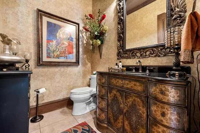 a spacious bathroom with a double vanity sink a mirror and a shower