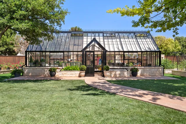 a view of a house with backyard porch and sitting area