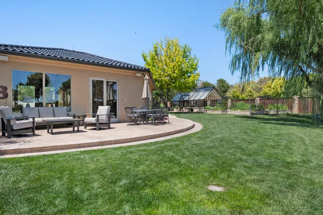 a view of a patio with a table chairs and a patio
