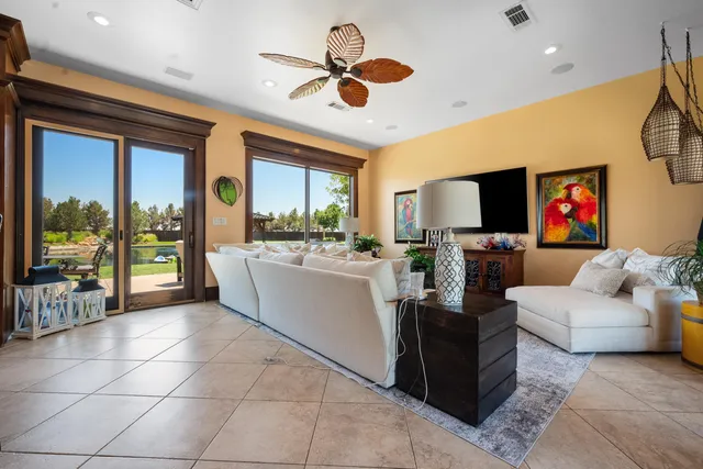 a front view of a house with a yard table and chairs