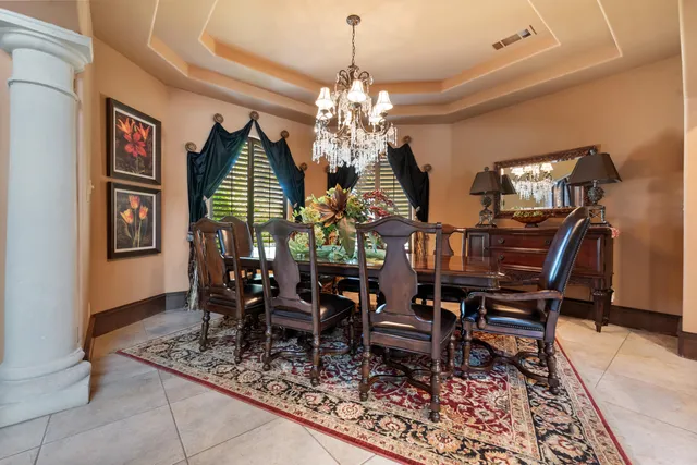 a room with lots of windows and furniture