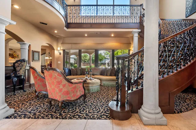 a living room with couches chairs and view of living room