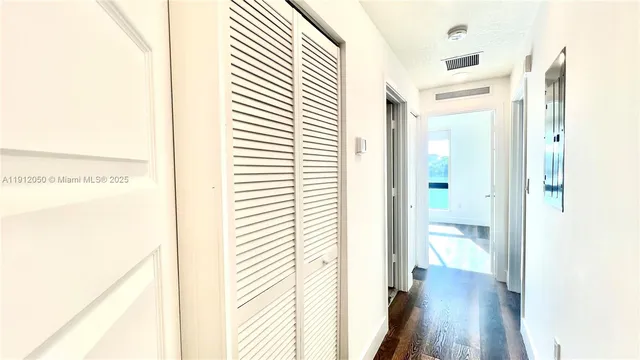 a view of a bathroom with a shower curtain