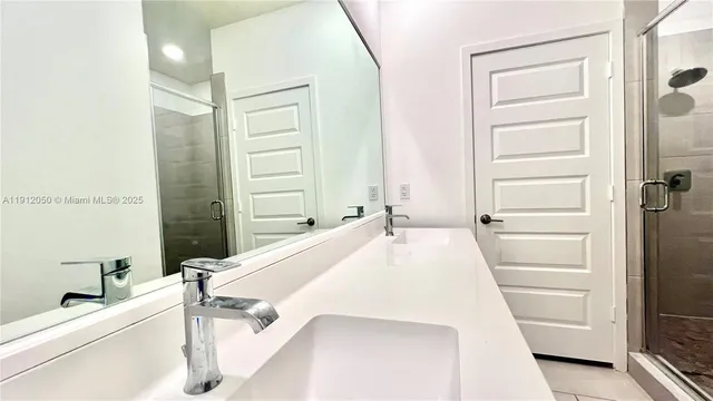 a bathroom with a bathtub and a sink