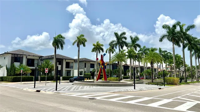 a view of a street with a building in the background