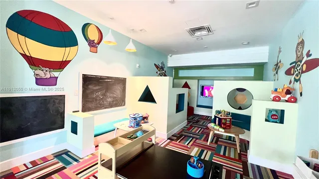 a living room with furniture a window and a table