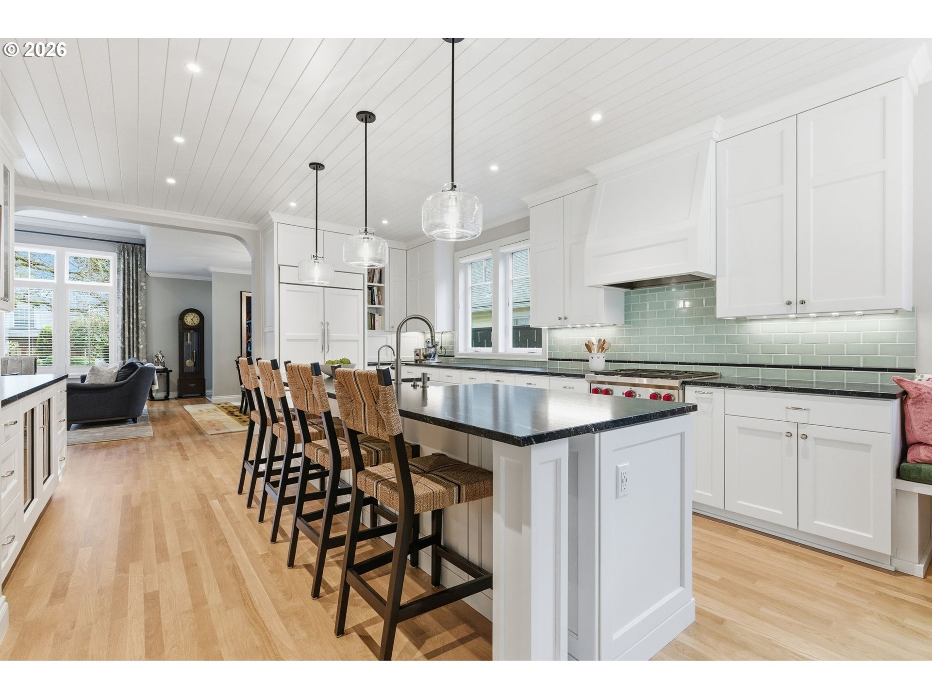 330 6th Street Lake Oswego, OR 97034 - Photo 12 of 48 a kitchen with stainless steel appliances granite countertop a kitchen island a stove a sink a dining table and chairs
