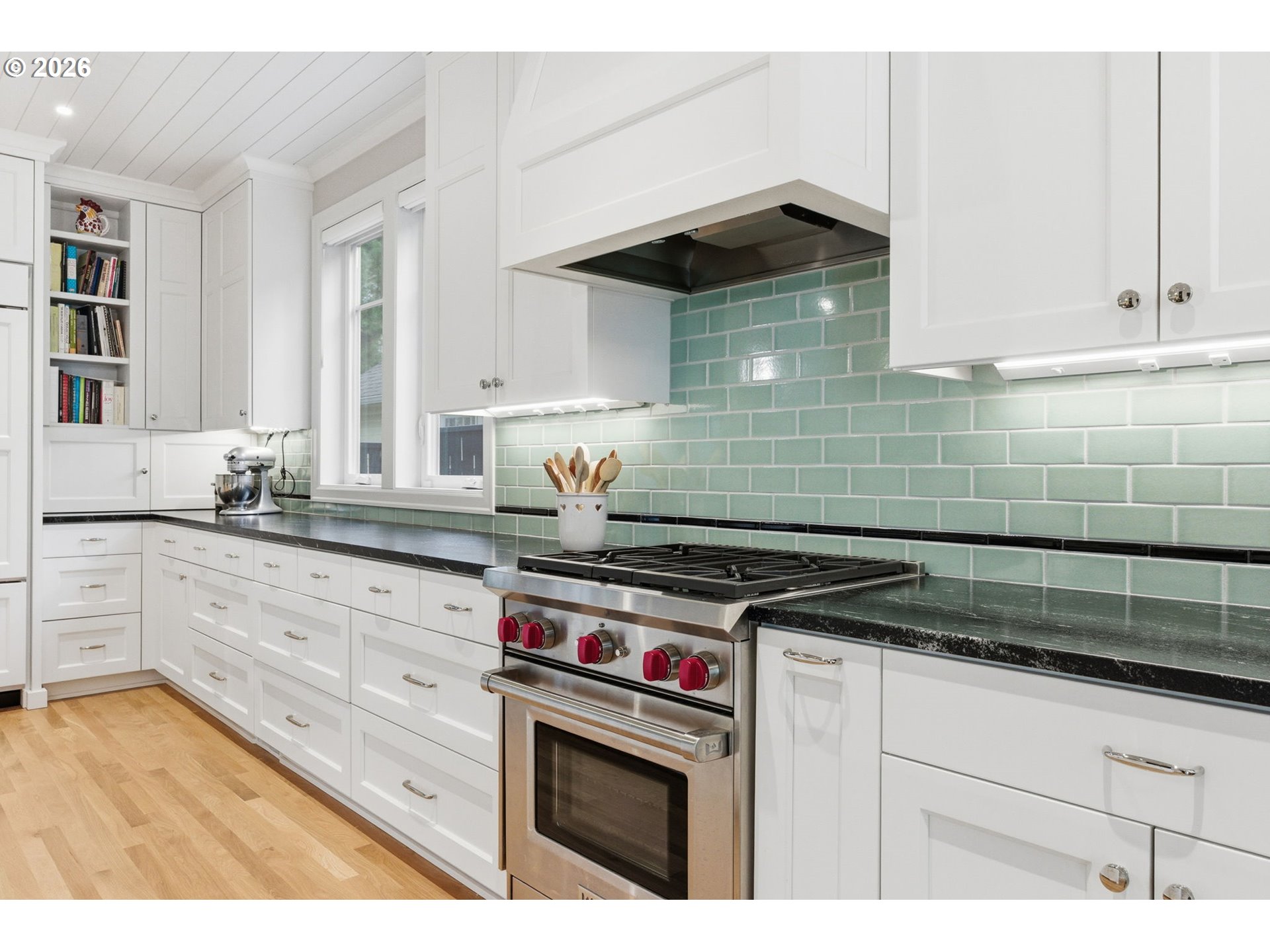 330 6th Street Lake Oswego, OR 97034 - Photo 21 of 48 a kitchen with granite countertop a stove a sink and dishwasher wooden cabinets