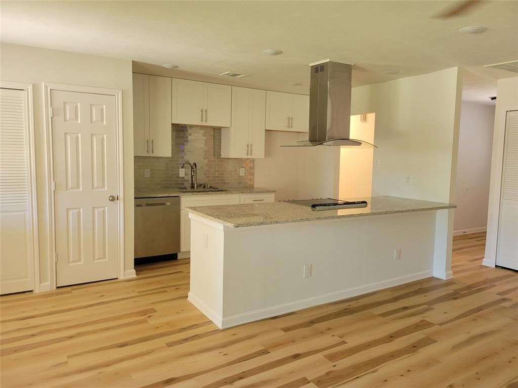 5510 Ridgecove Drive Garland, TX 75043 - Photo 4 of 11 a kitchen with a refrigerator and a stove