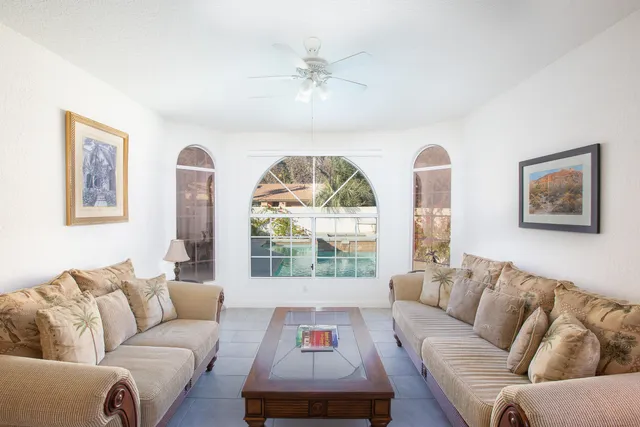 a living room with furniture and a large window