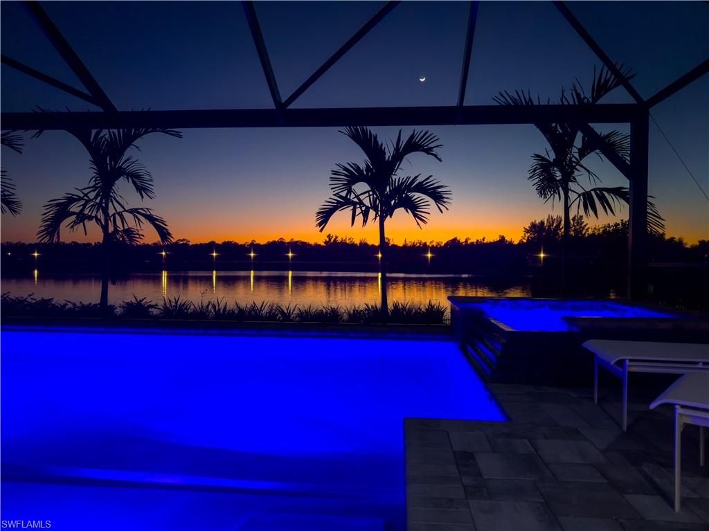 8795 Calypso Court Naples, FL 34113 - Photo 1 of 49 a view of swimming pool with outdoor seating