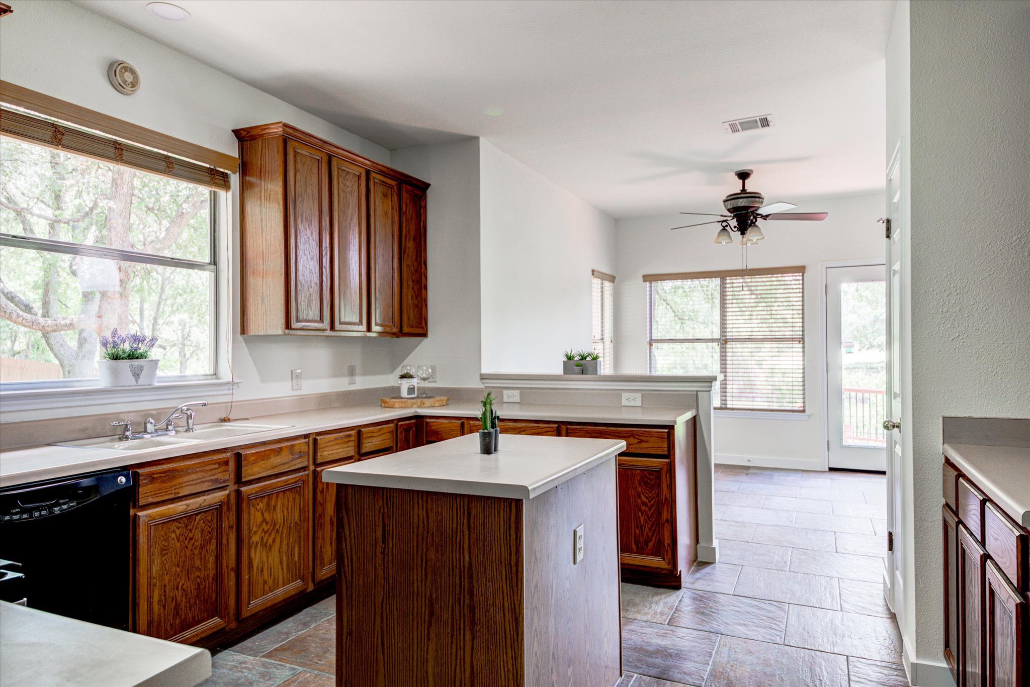 6301 Thirlmare Court Austin, TX 78754 - Photo 12 of 40 Even preparing meals, you can catch the restful view from this spacious kitchen.