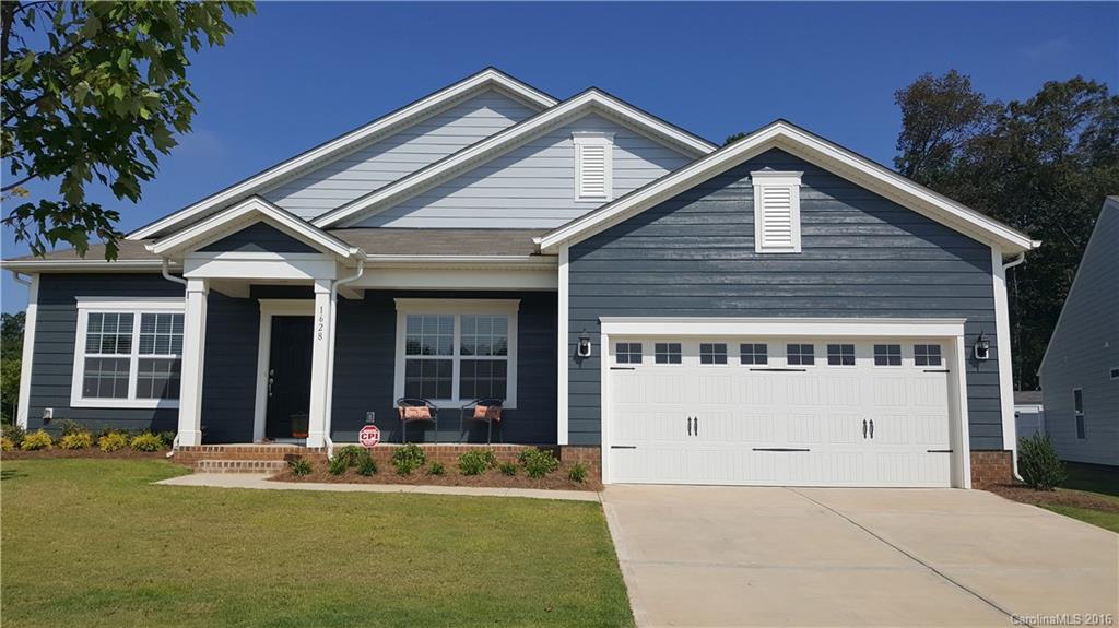 1628 Spring Blossom Trail, Unit SITE 18 Fort Mill, SC 29708 - Photo 2 of 22 a front view of a house with a yard