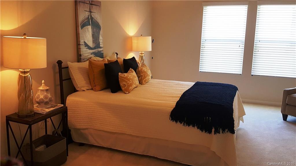 1628 Spring Blossom Trail, Unit SITE 18 Fort Mill, SC 29708 - Photo 14 of 22 a bedroom with a large bed and a window