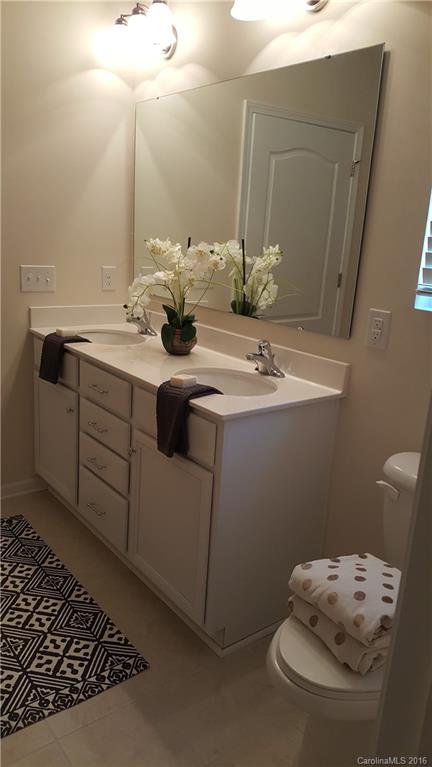 1628 Spring Blossom Trail, Unit SITE 18 Fort Mill, SC 29708 - Photo 15 of 22 a bathroom with a sink and a mirror