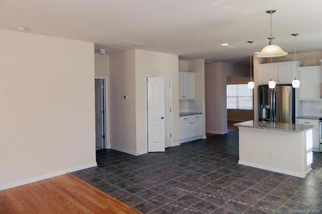 1628 Spring Blossom Trail, Unit SITE 18 Fort Mill, SC 29708 - Photo 18 of 22 a view of a kitchen cabinets and a wooden floor