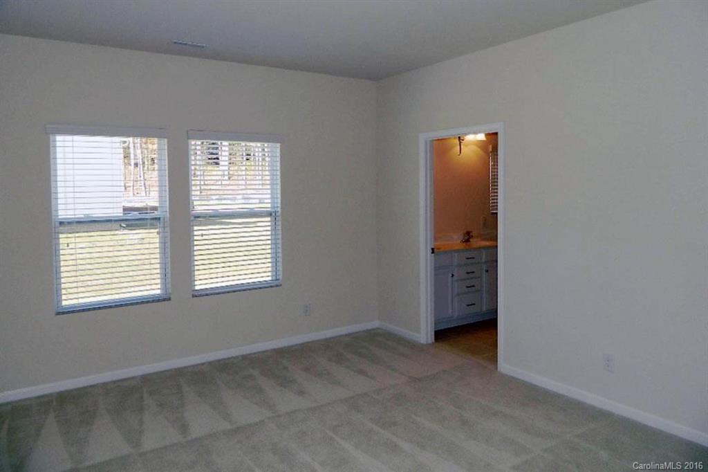 1628 Spring Blossom Trail, Unit SITE 18 Fort Mill, SC 29708 - Photo 20 of 22 a view of an empty room with a window