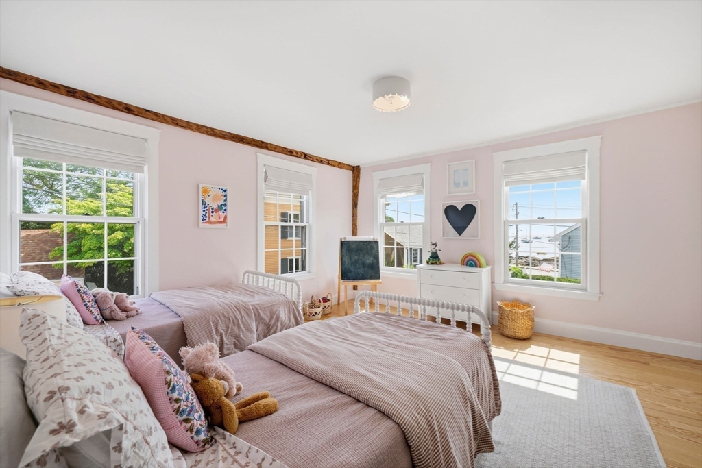 33 Franklin Street Marblehead, MA 01945 - Photo 20 of 42 a bedroom with a bed and a window