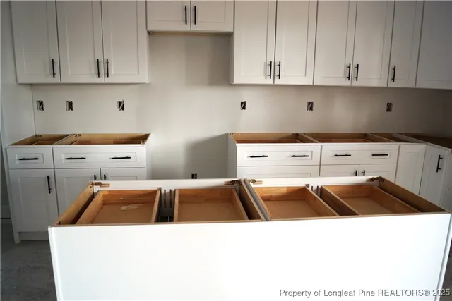 a kitchen that has a sink and a stove