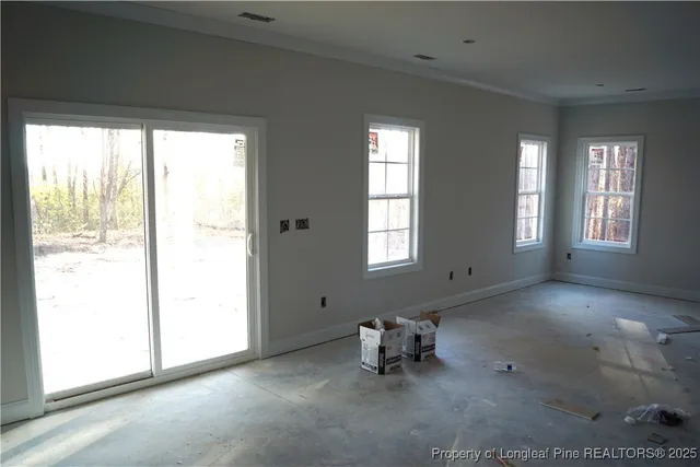 a view of livingroom with furniture and windows