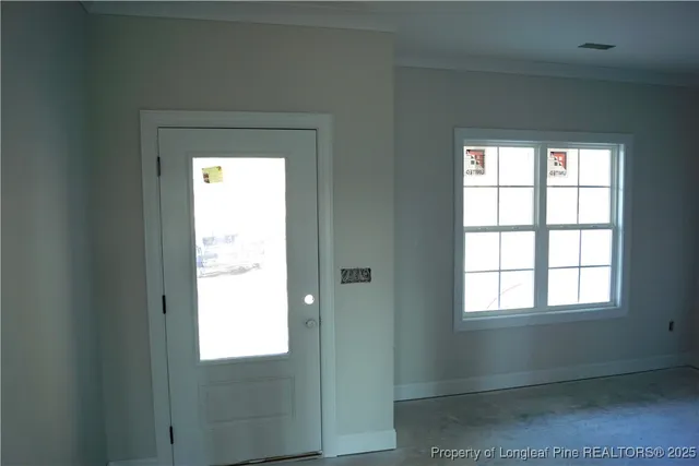 a view of an empty room and a window
