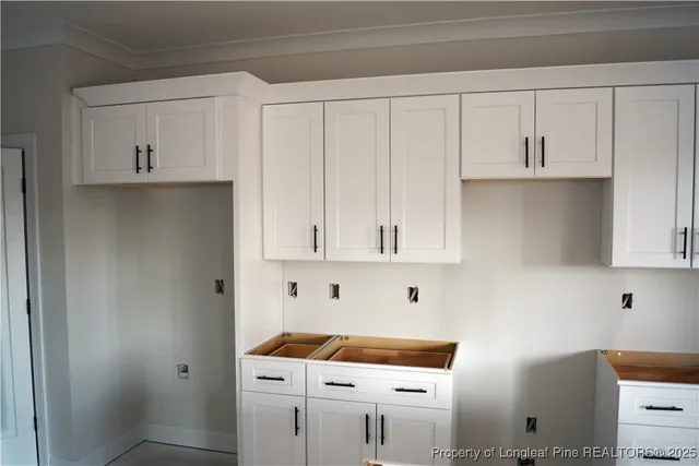 a room with cabinets and dust bin