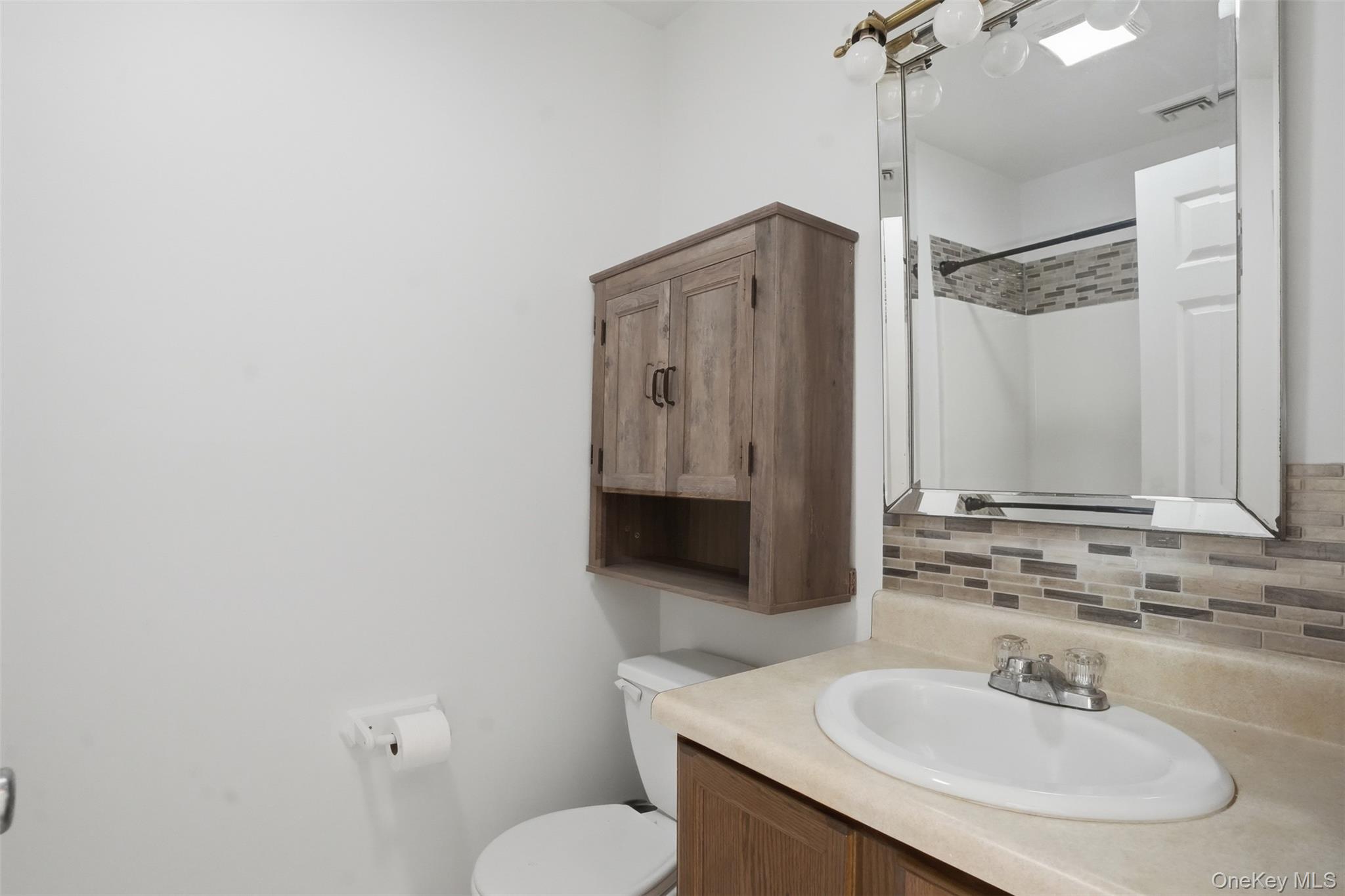 160 Pirog Road Pine Bush, NY 12566 - Photo 27 of 50 a bathroom with a sink a toilet and shower