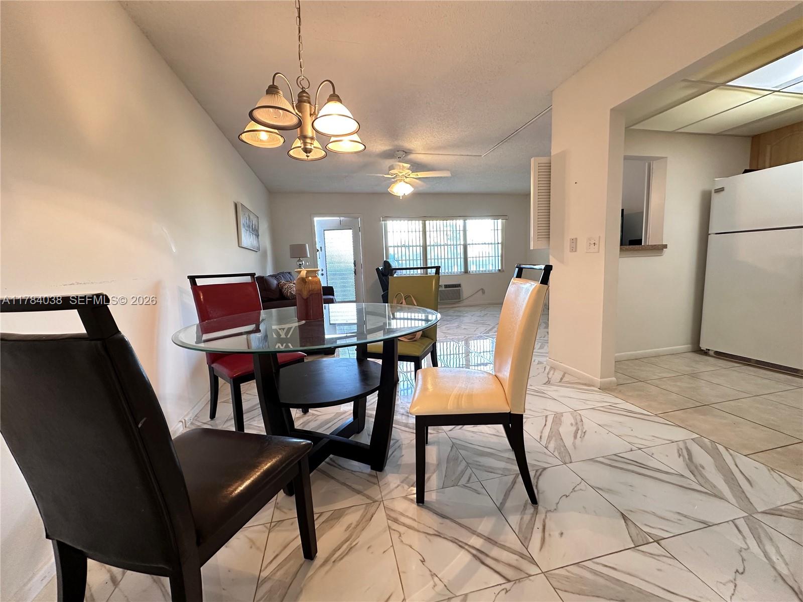 569 Fanshaw North, Unit 569 Boca Raton, FL 33434 - Photo 10 of 22 a dining room with furniture and window