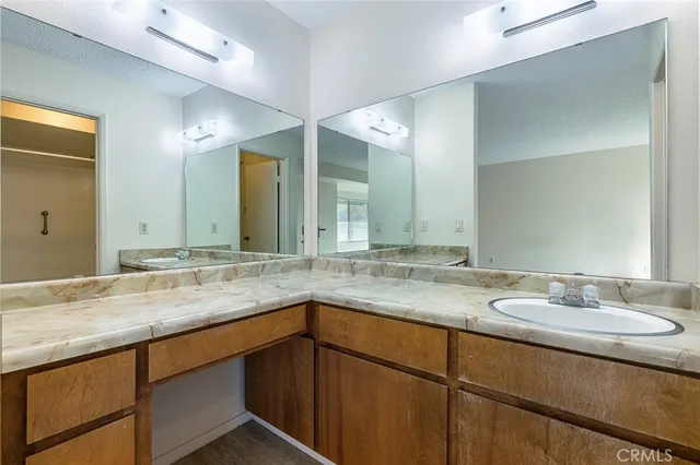 a view of an empty room with a kitchen
