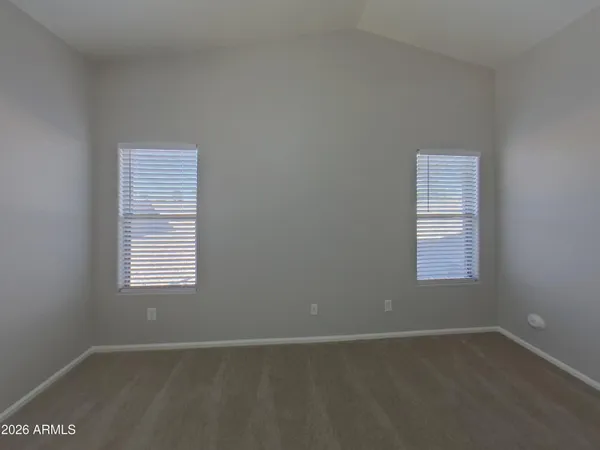 a kitchen with sink a refrigerator and a stove top oven