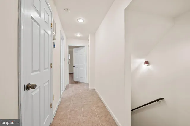a view of a hallway with white walls