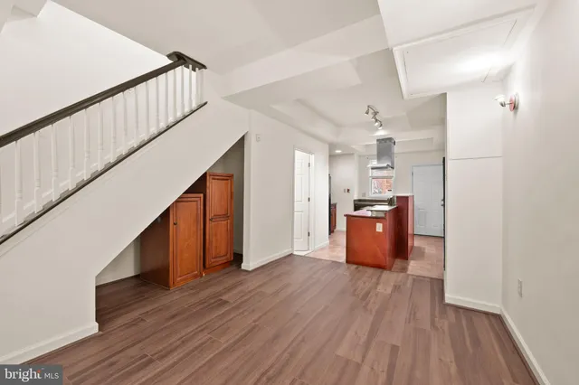 a view of kitchen and wooden floor