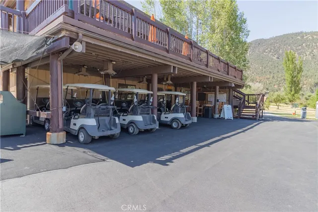 a view of a swimming pool with a table and chairs