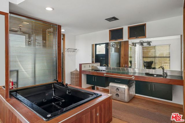 a kitchen with a sink and wooden cabinets