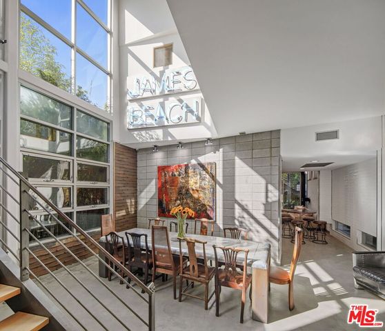 a view of a chairs and table in a balcony