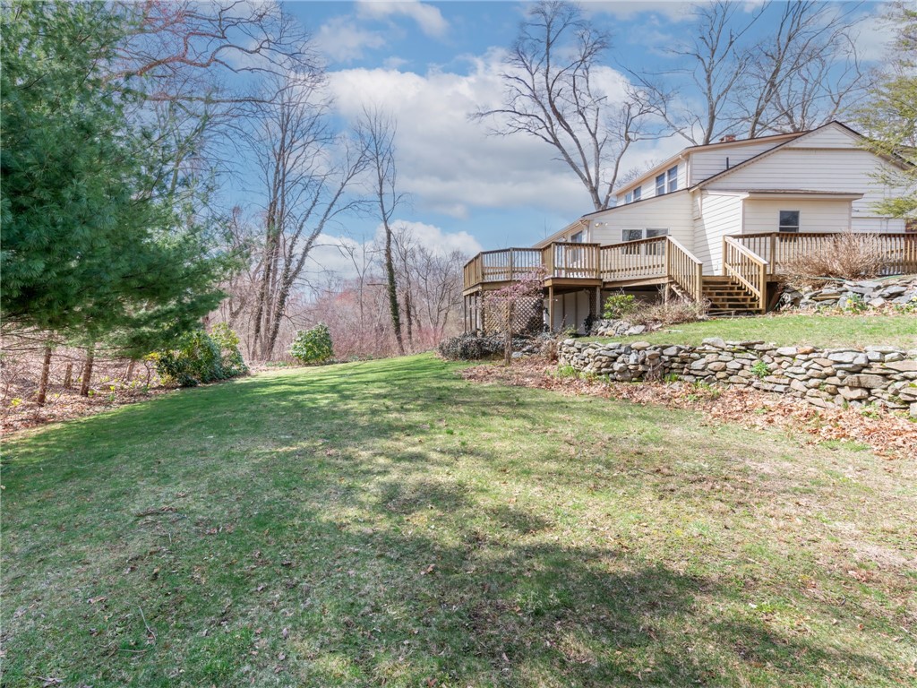 26 Anthony Street Warwick, RI 02886 - Photo 30 of 37 Wrap-around deck with wooded privacy