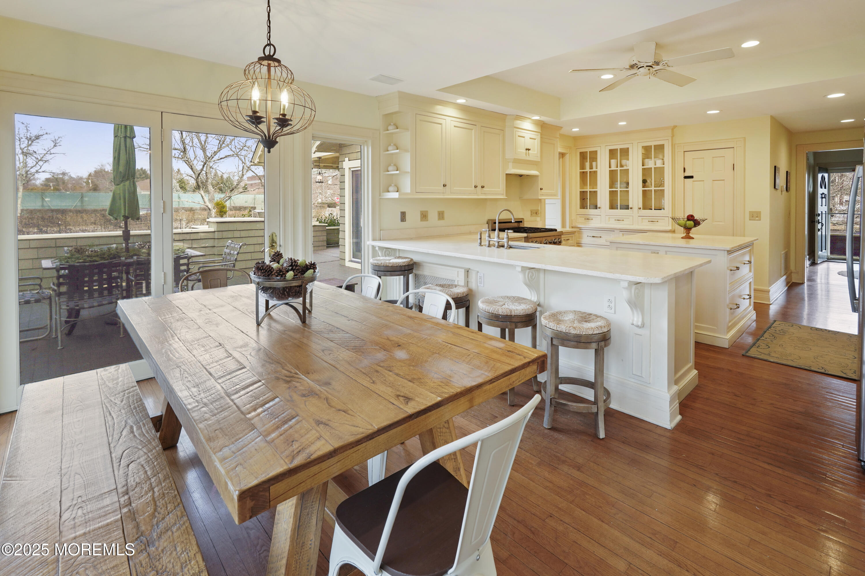 43 Rumson Road Rumson, NJ 07760 - Photo 13 of 28 a dining room with furniture a chandelier and wooden floor