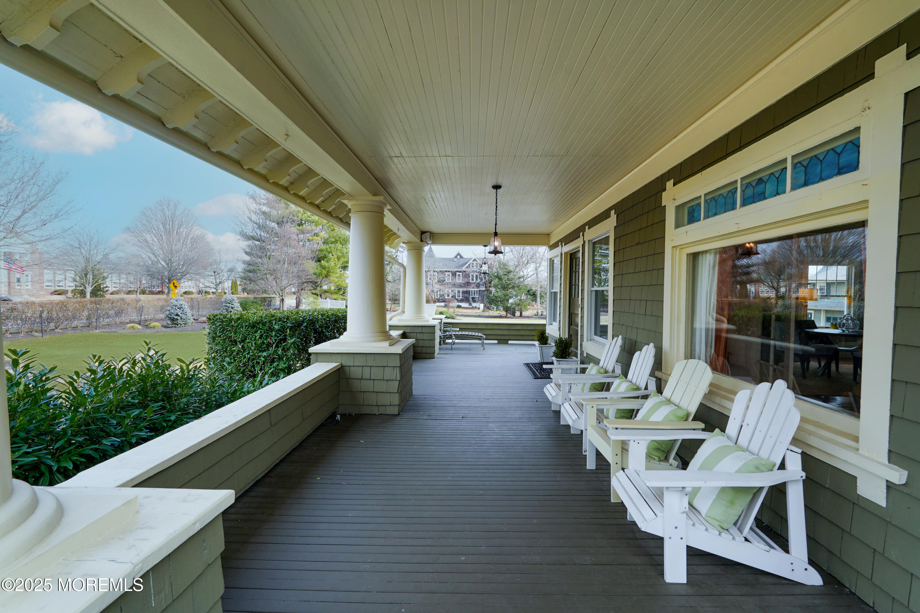 43 Rumson Road Rumson, NJ 07760 - Photo 28 of 28 a balcony with couple of chairs and couches with wooden floor