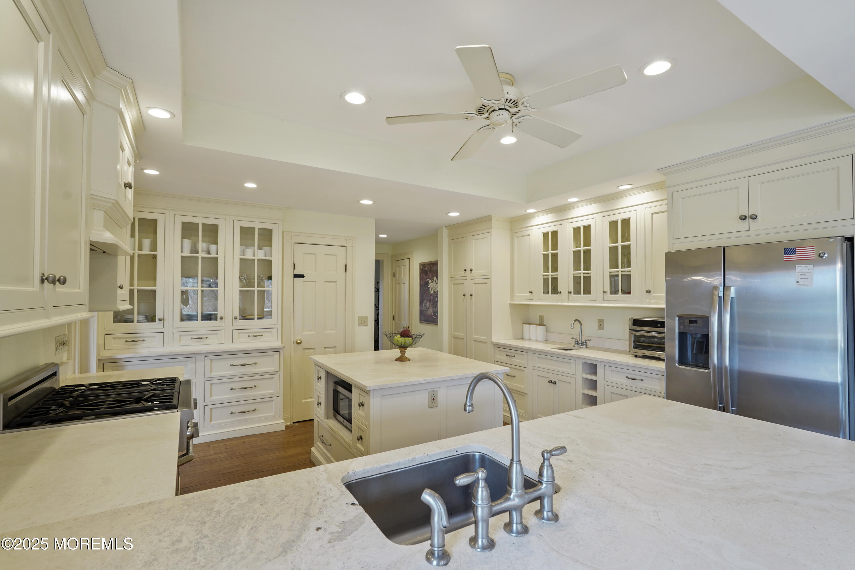 43 Rumson Road Rumson, NJ 07760 - Photo 10 of 28 a large white kitchen with a large window appliances and cabinets