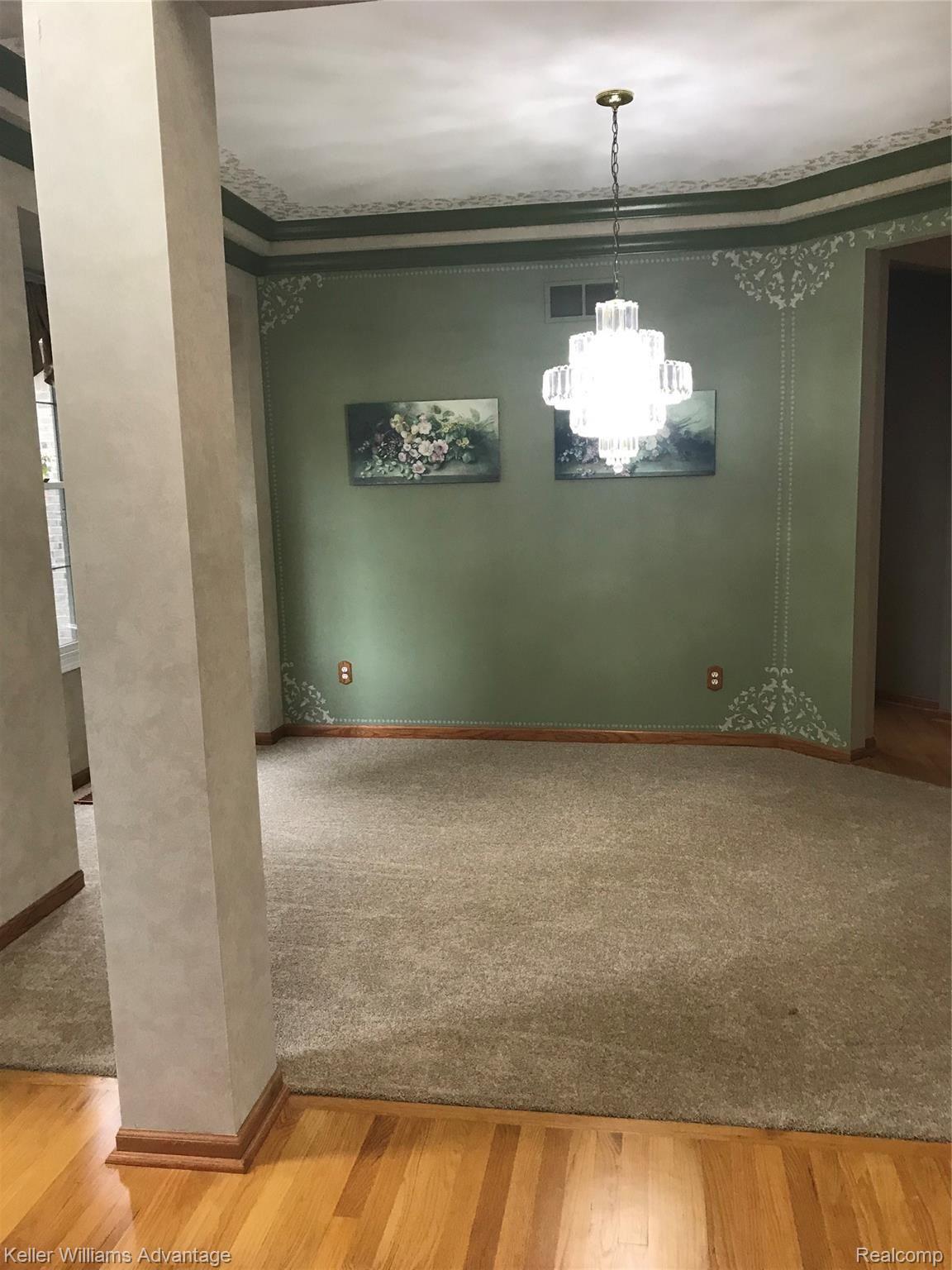 47719 Pavillon Road Canton, MI 48188 - Photo 16 of 50 Dining room off foyer with crown molding.