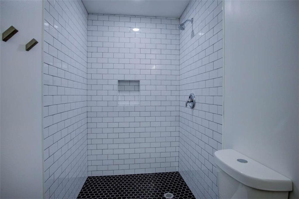 7225 Pineneedle Drive Southwest Covington, GA 30014 - Photo 21 of 37 a bathroom with a toilet