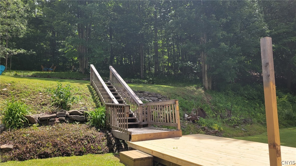 4524 Maybury Road Solon, NY 13101 - Photo 17 of 42 Brand new deck/stairs up to fire pit landing