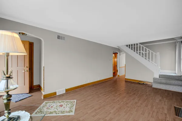 a view of an entryway with wooden floor