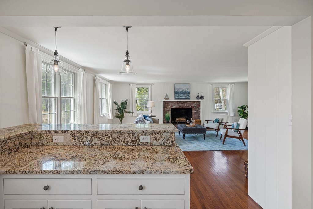 32 Howland Lane Hingham, MA 02043 - Photo 11 of 40 a living room with fireplace furniture and a fireplace