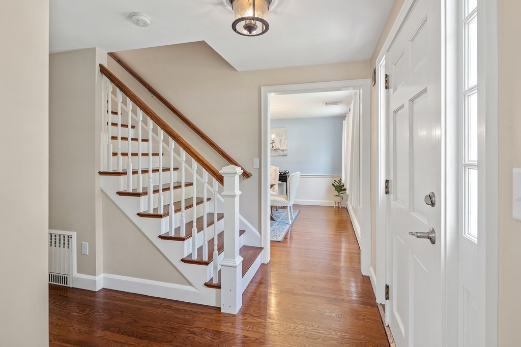 32 Howland Lane Hingham, MA 02043 - Photo 17 of 40 a view of a hallway with wooden floor and staircase