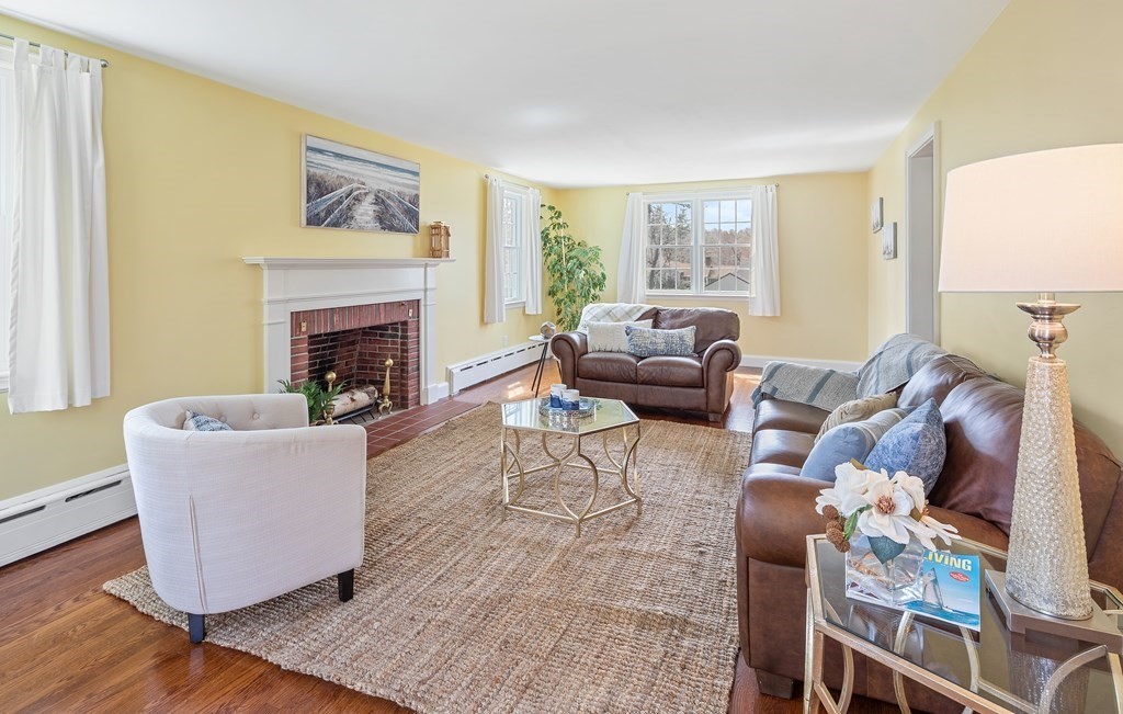 32 Howland Lane Hingham, MA 02043 - Photo 18 of 40 a living room with furniture and a fireplace